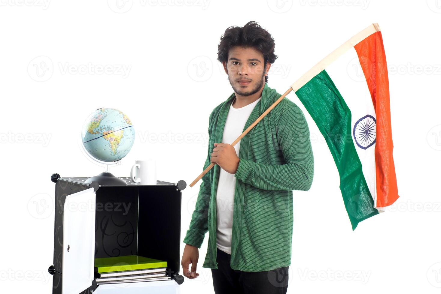 Young man with Indian flag or tricolor with world globe on white background, Indian Independence day, Indian Republic day photo