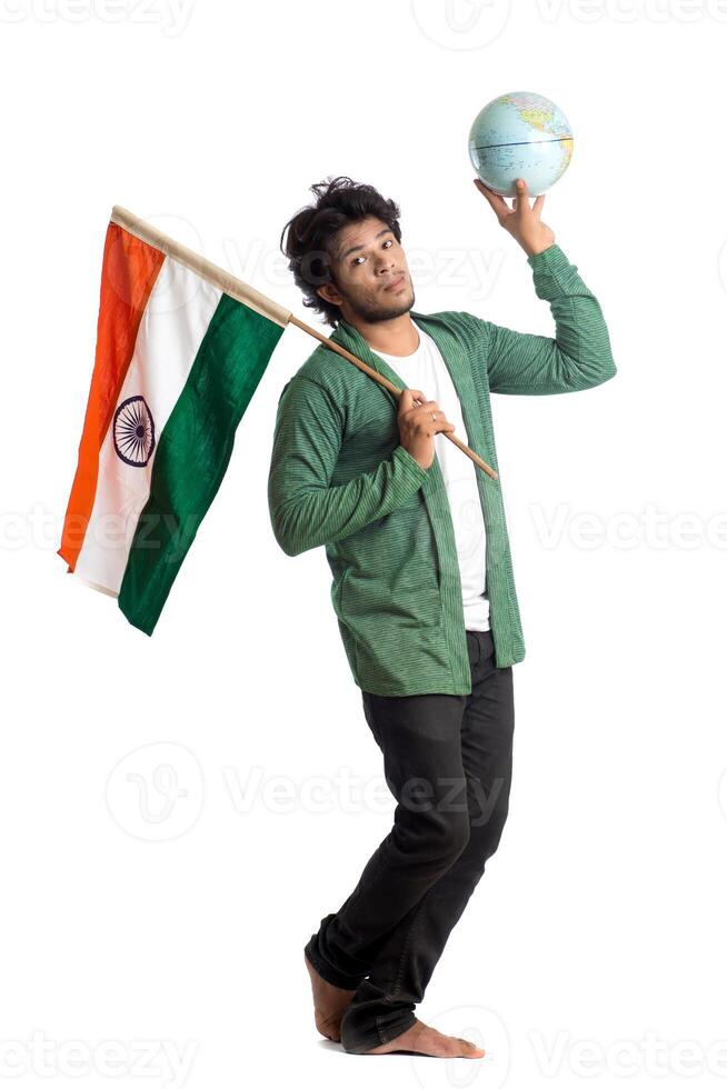 Young man with Indian flag or tricolor with world globe on white background, Indian Independence day, Indian Republic day photo