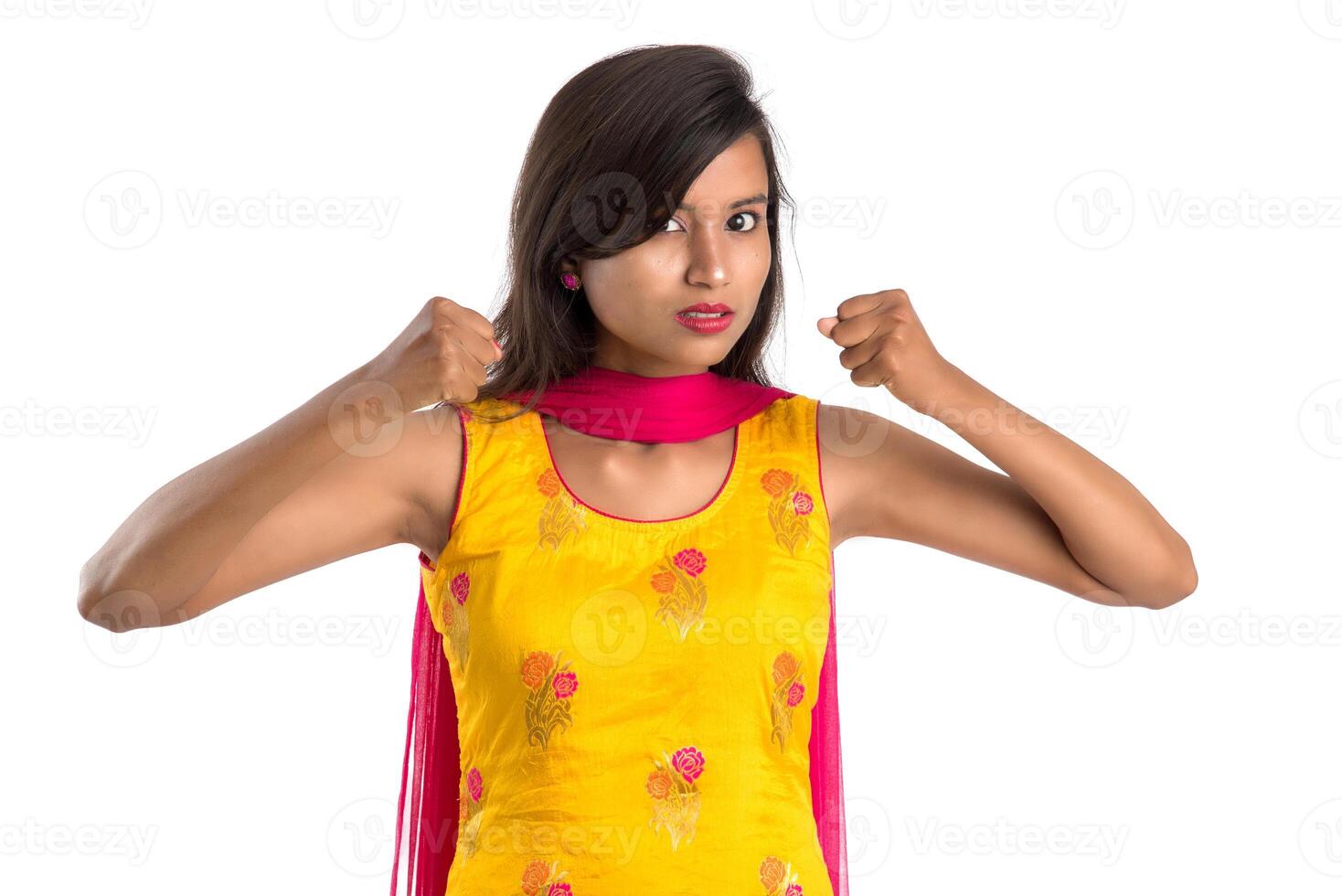 Portrait of a beautiful girl showing stop sign with palms isolated on a white background photo