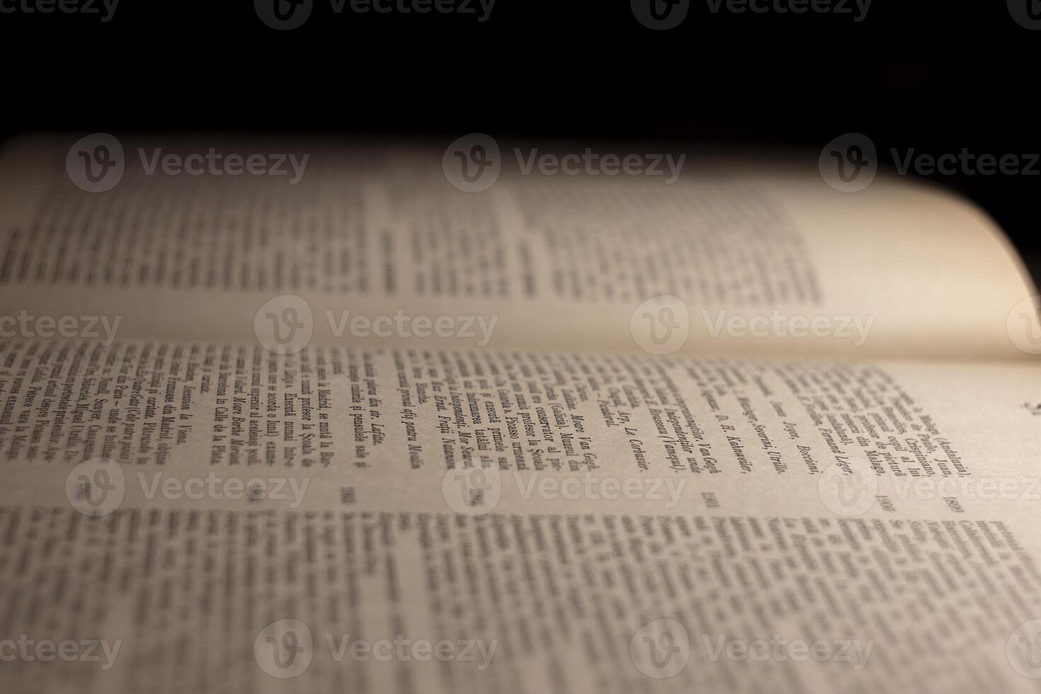 macro photography of a book page with text in Latin font photo