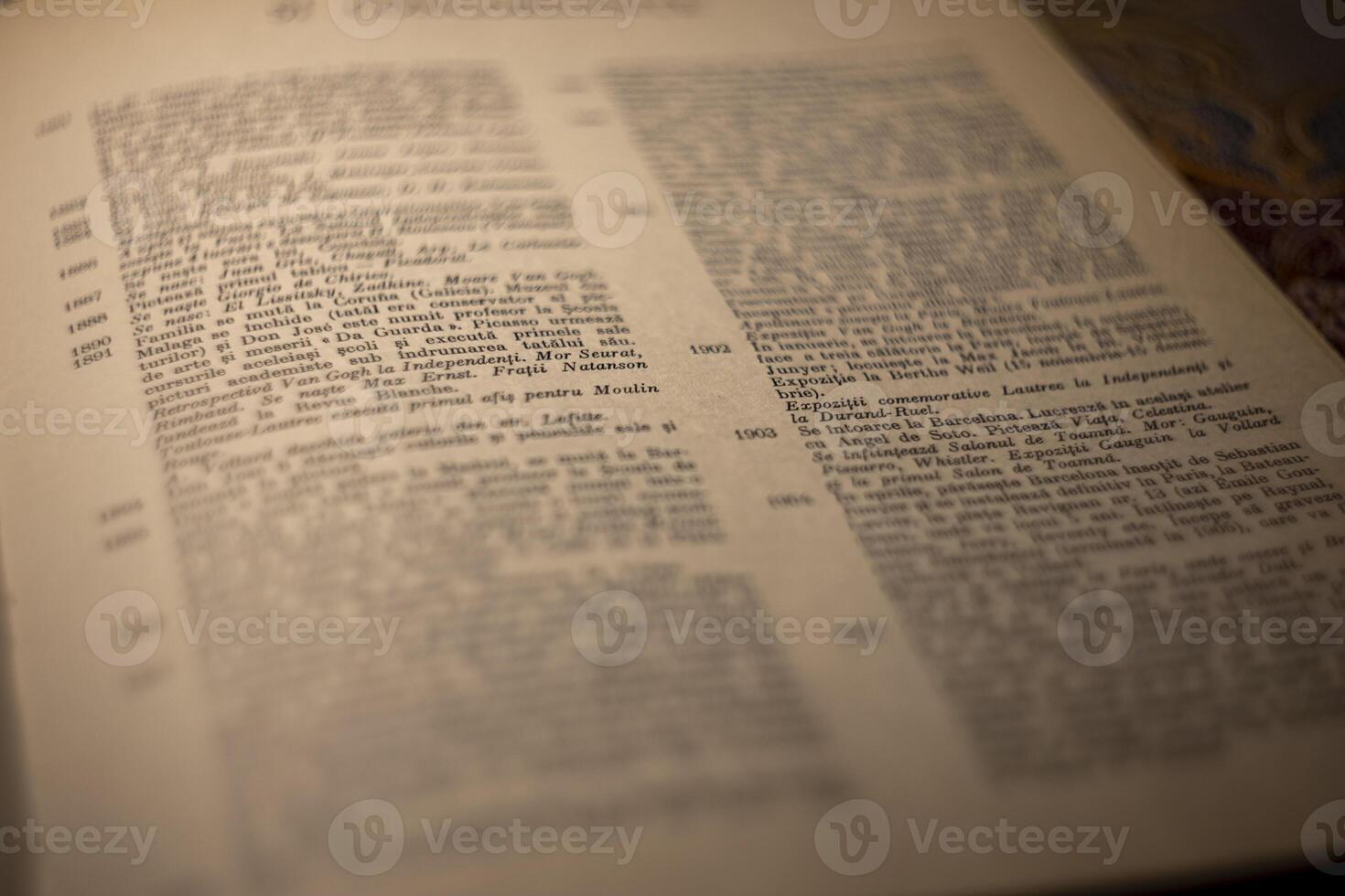 macro photography of a book page with text in Latin font photo