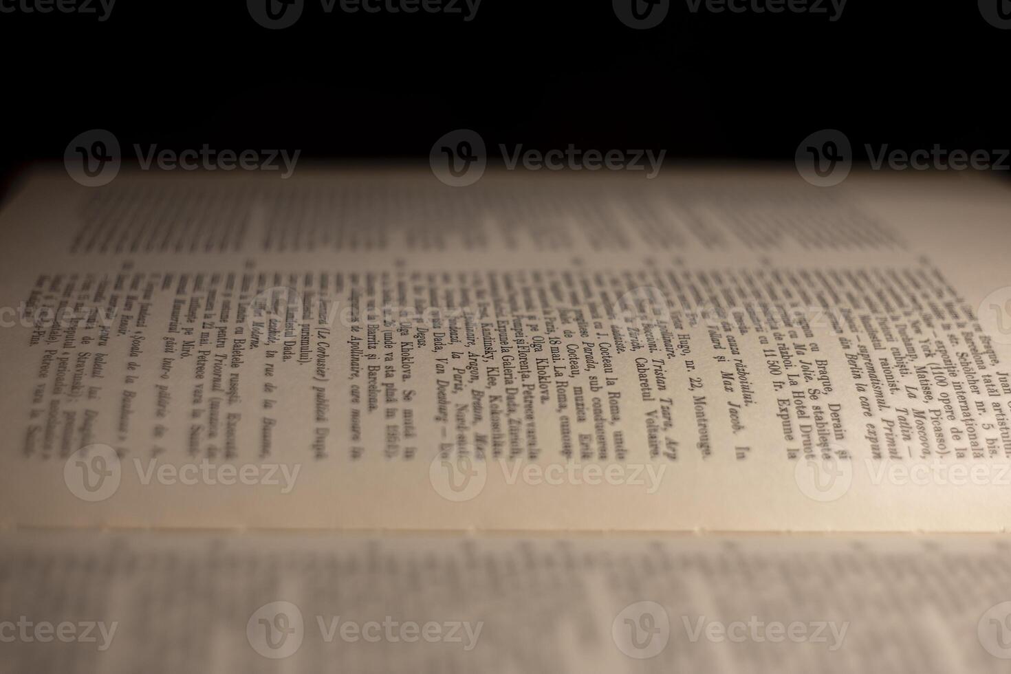 macro photography of a book page with text in Latin font photo