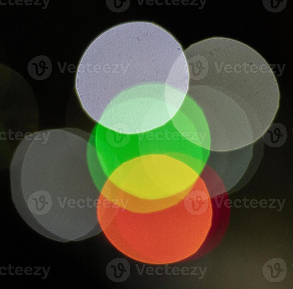 Bokeh abstract texture. Colorful blurred bright traffic lights photo