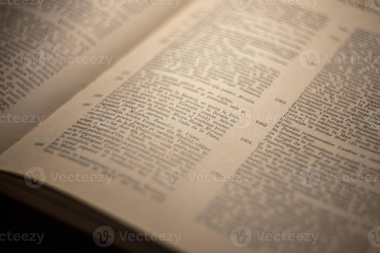 macro photography of a book page with text in Latin font photo
