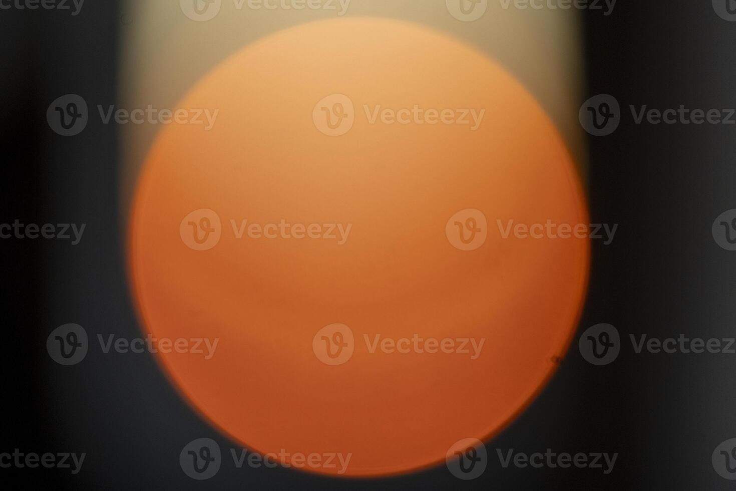 sunset out of focus, blurred solar disk photo