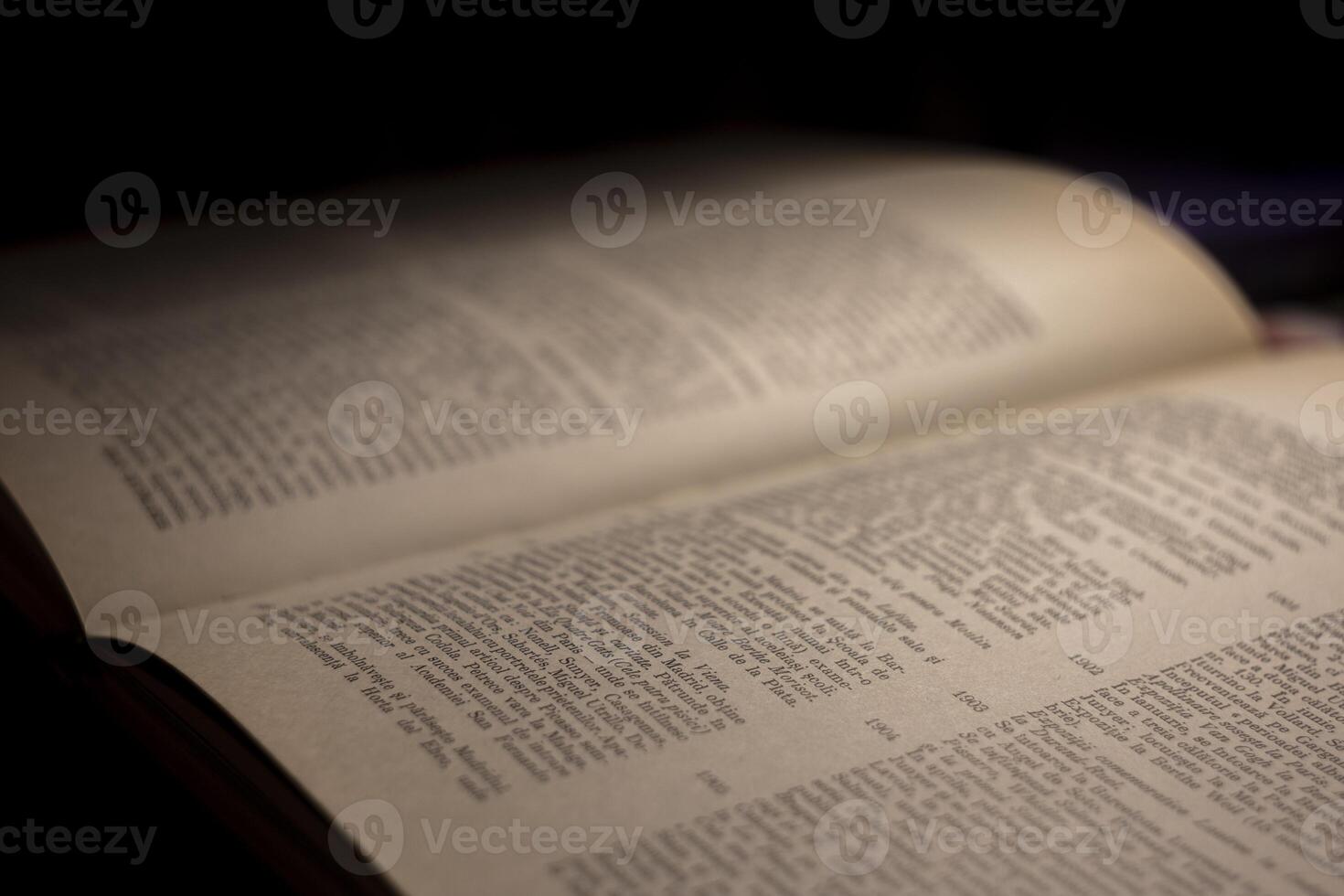 macro photography of a book page with text in Latin font photo