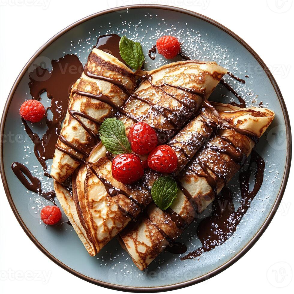 Chocolate crepe on plate top view isolated on white background with shadow. Chocolate pancake dessert on ceramic plate photo