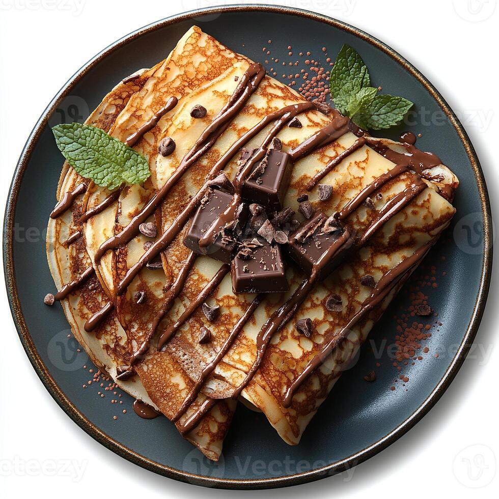 Chocolate crepe on plate top view isolated on white background with shadow. Chocolate pancake dessert on ceramic plate photo