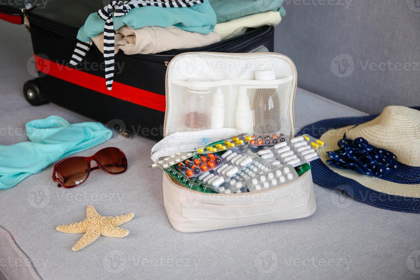 Summer beach accessories for your sea holiday and pills. Concept of medication required in journey. photo
