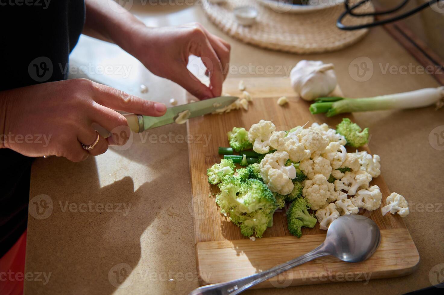 Preparing fresh vegetables for a healthy meal in the kitchen photo