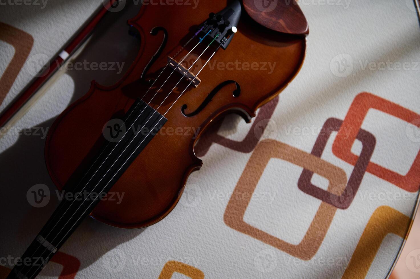 Top view of a violin on a patterned surface photo