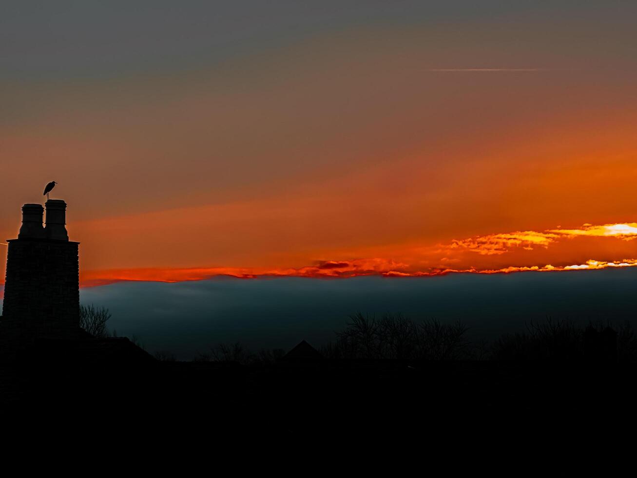 A sunset over a city photo