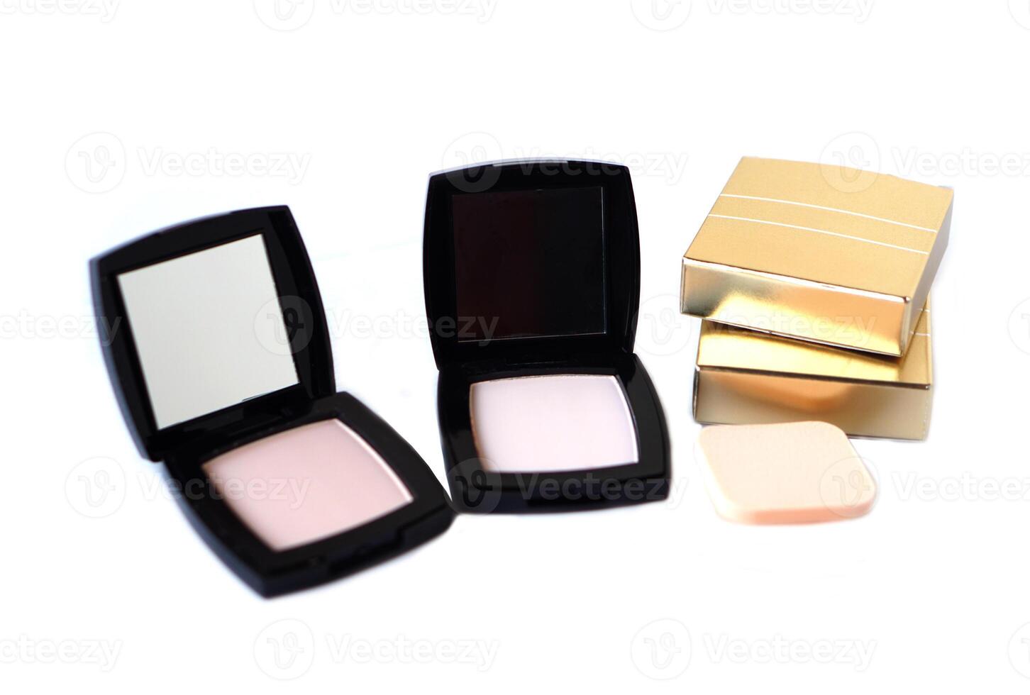 Black plastic powder cases. Cosmetic face powder or makeup puff on white background. Concept, beauty cosmetic. Facial skin care, apply on face for covering freckle spots, wrinkles. photo