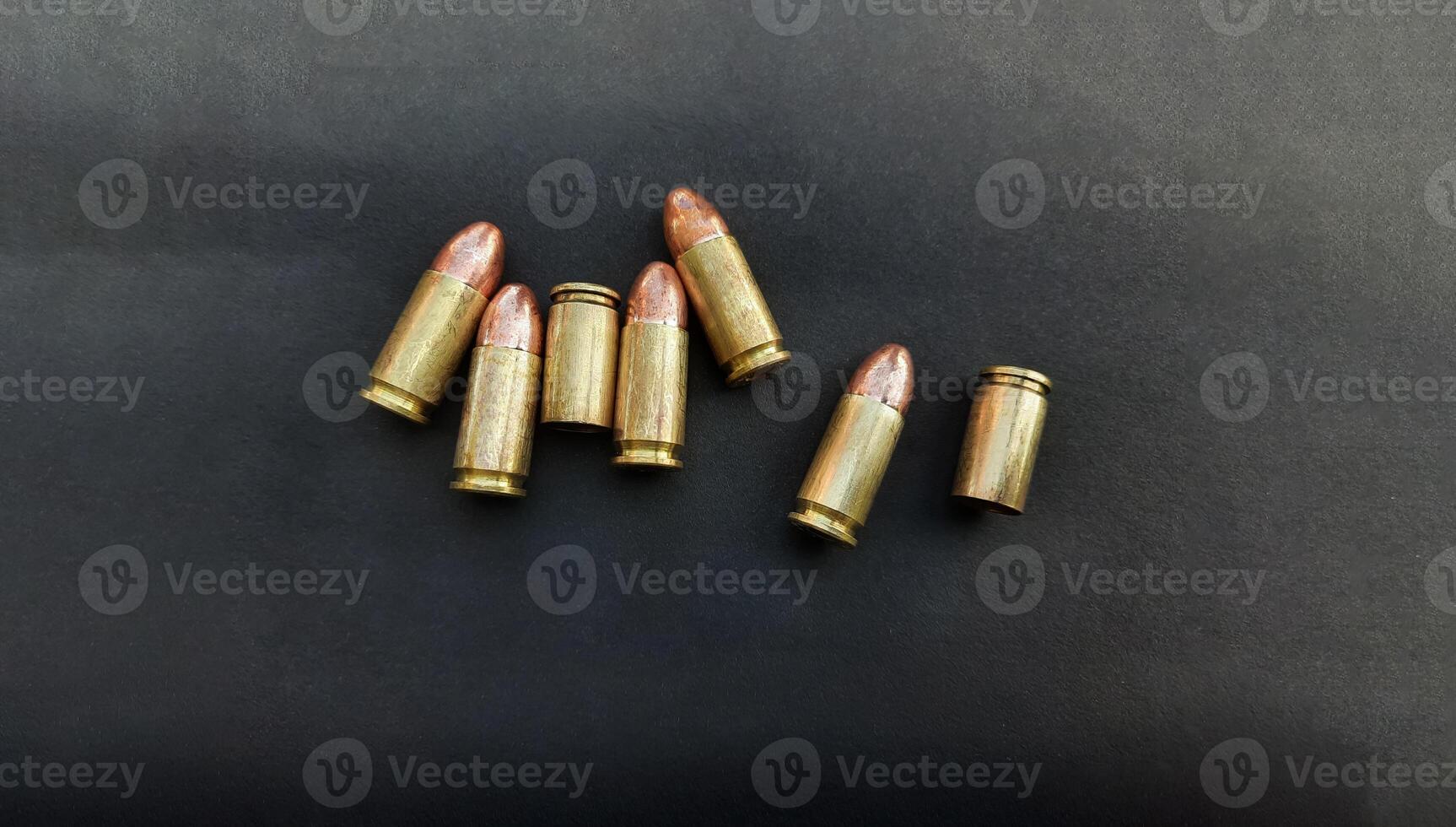 9mm pistol gun bullets and cartridge cases. Flat lay. Space for text. Concept, dangerous weapon for shooting. photo