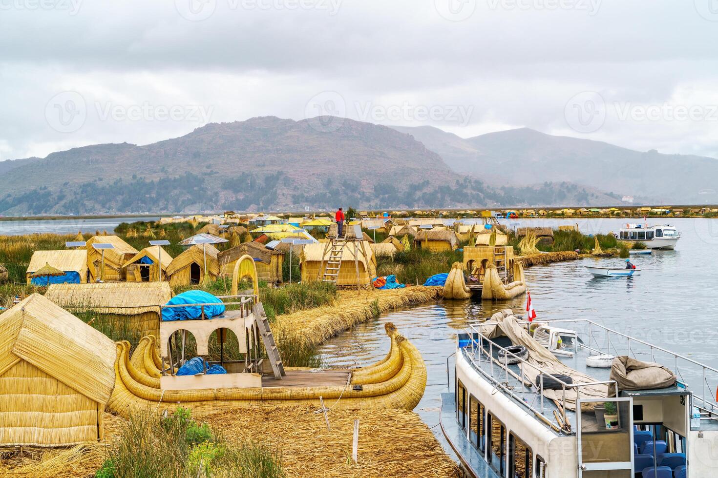 View at the Floating Island Los Uros with typical boats photo