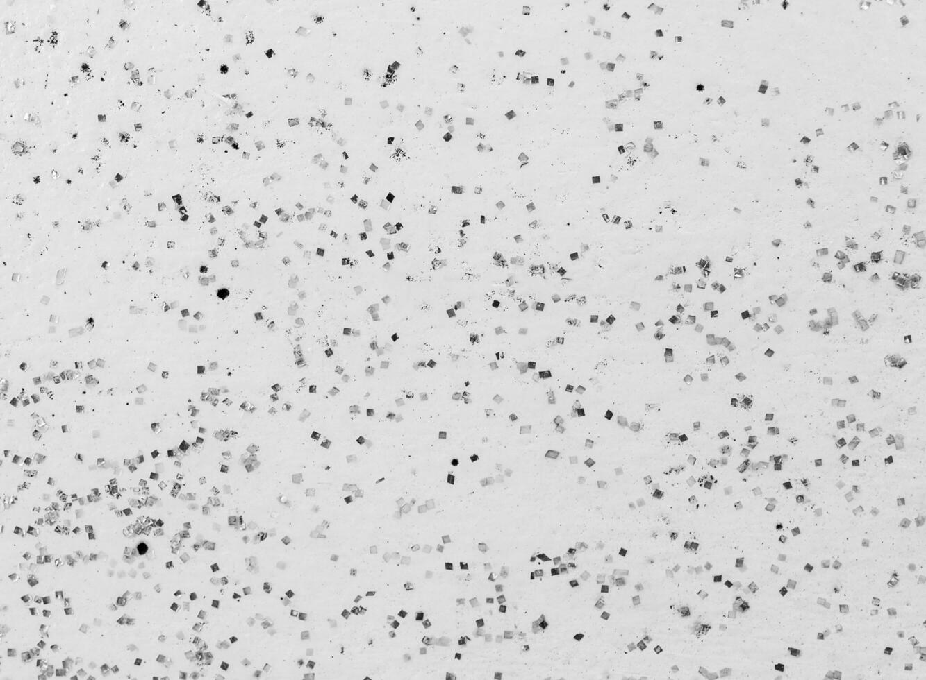 Black dot on white wall background photo