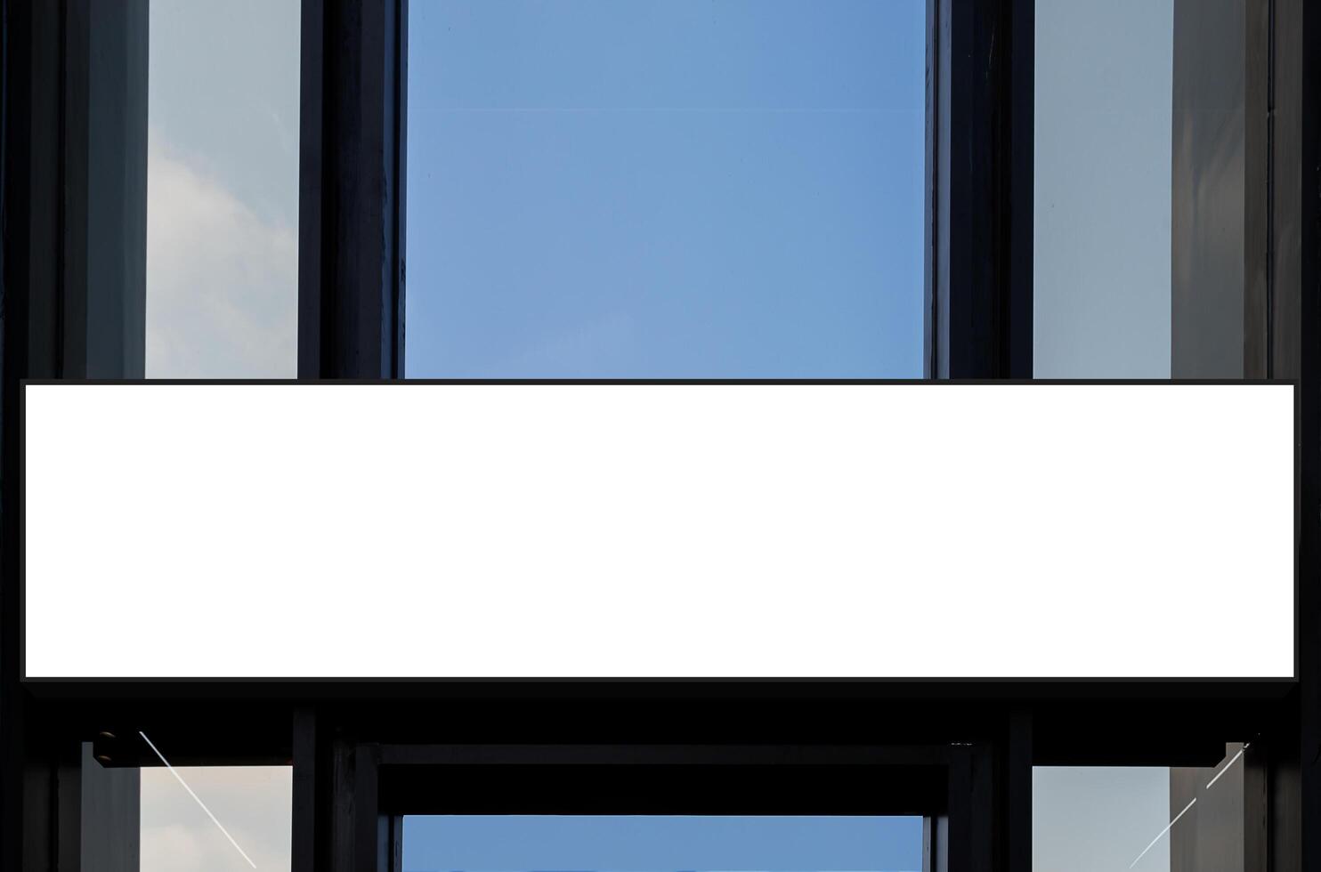 Mock up white horizontal billboard on entrance building. Clipping path for mockup photo