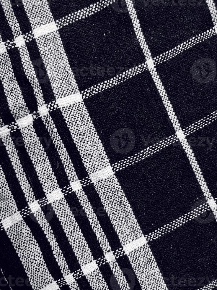 Black fabric background and pattern with white stripes photo