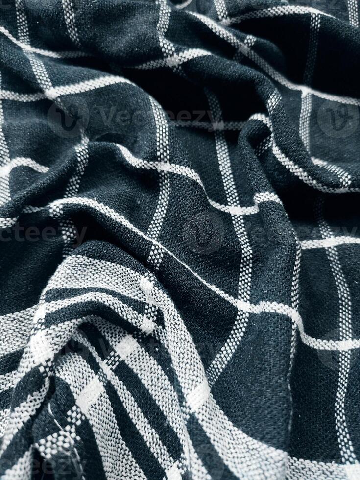 Black fabric background and pattern with white stripes photo