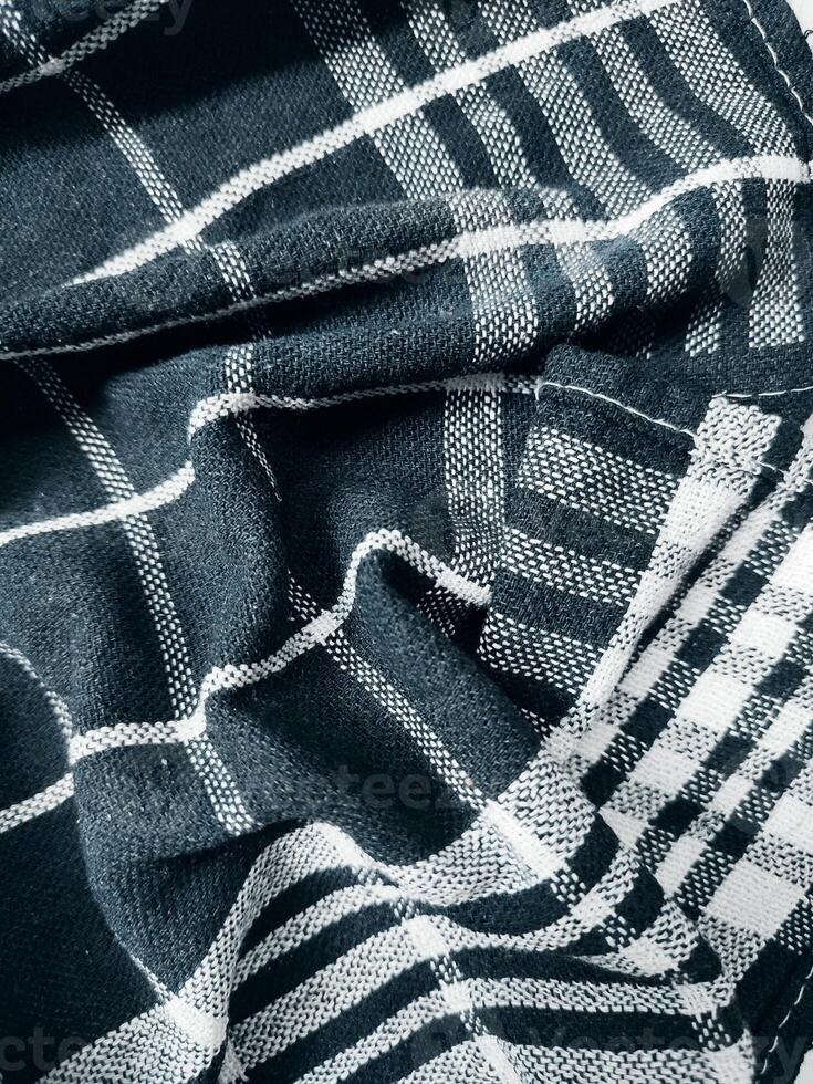 Black fabric background and pattern with white stripes photo