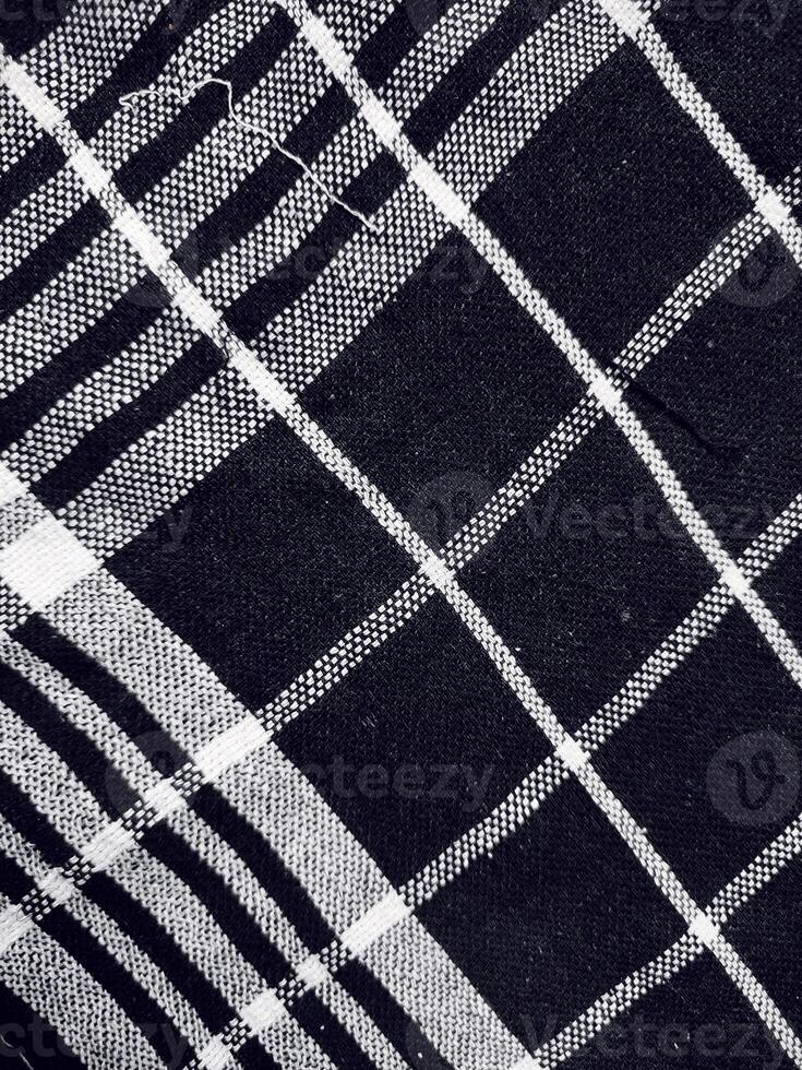 Black fabric background and pattern with white stripes photo