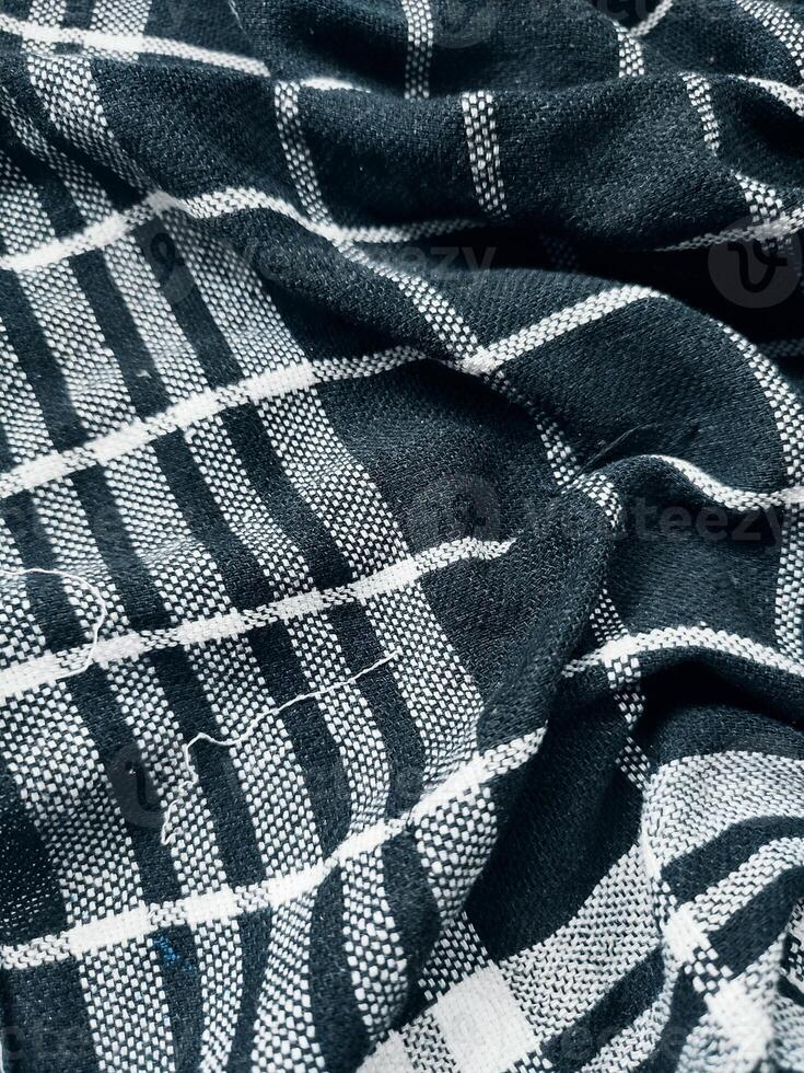 Black fabric background and pattern with white stripes photo