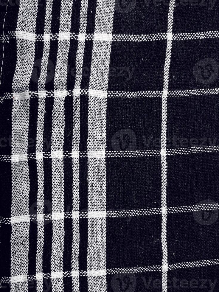 Black fabric background and pattern with white stripes photo