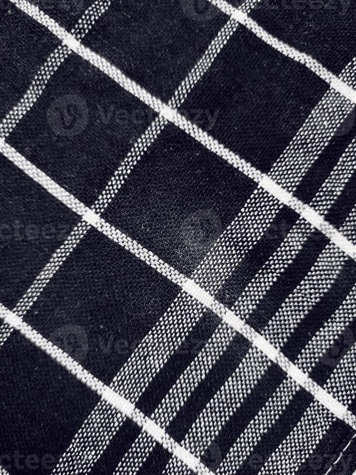 Black fabric background and pattern with white stripes photo