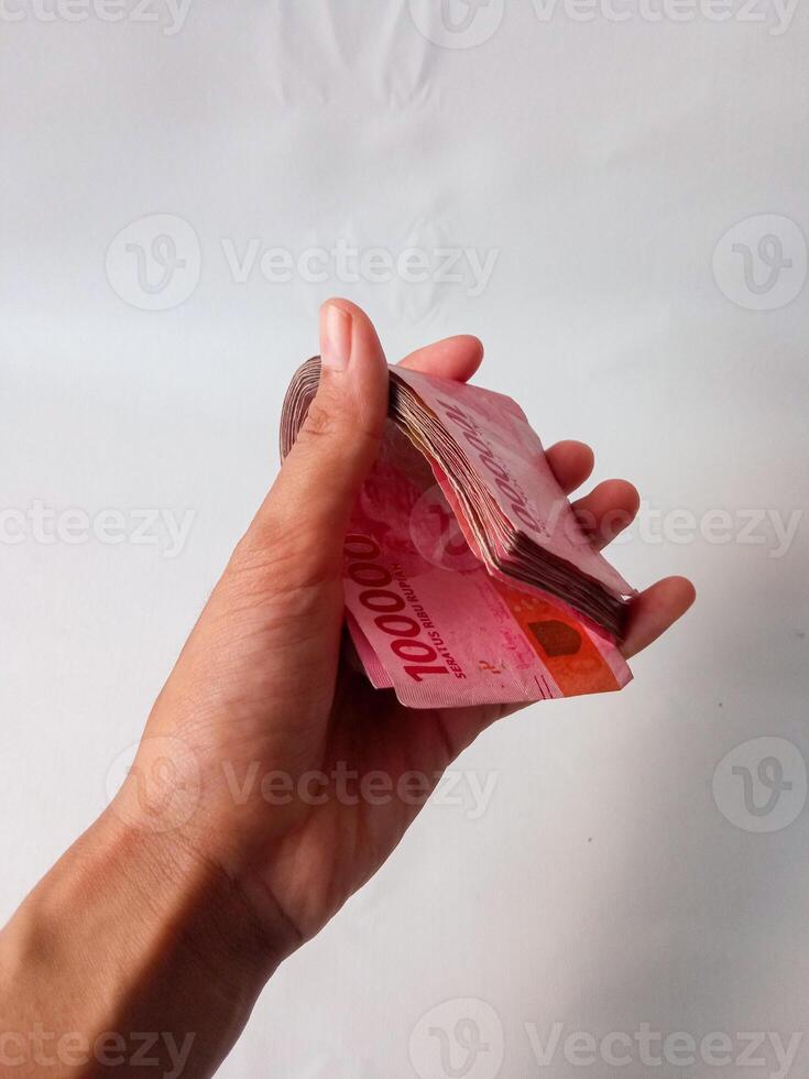 Cash payment concept. Indonesian rupiah currency Rp. 100.000 Seratus Ribu Rupiah One hundred thousand Indonesian rupiah money. photo