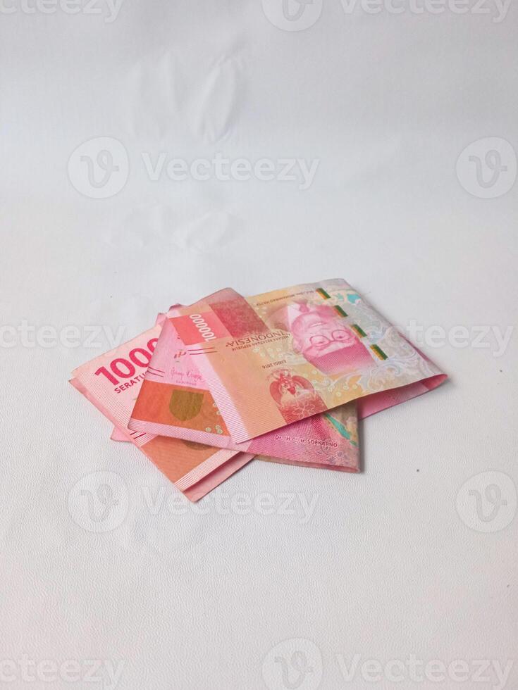Picture, images of various angle of IDR Indonesian Rupiahs, 100000 money paper printed by Peruri, A hundred thousands rupiahs, Seratus ribu rupiah uang kertas IDR photo