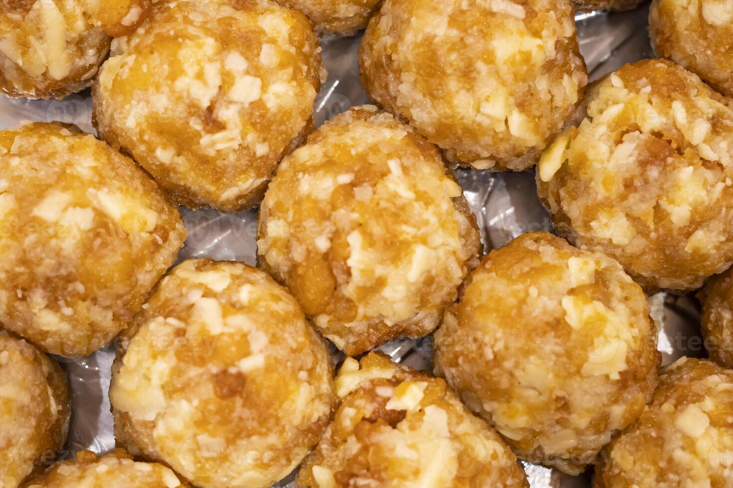 Nikhudi Laddu motichoor texture closeup top view of indian, pakistani and bangladeshi sweets dessert photo