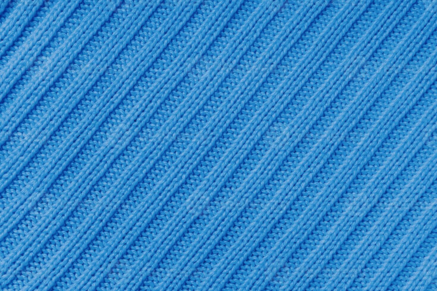 Jersey textile background , blue diagonal striped knitted fabric, cloth surface photo