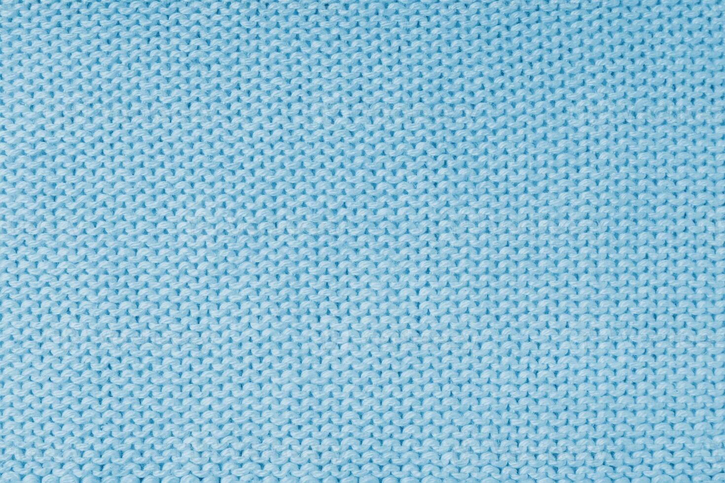 Knitted background, blue jersey viscose fabric texture photo