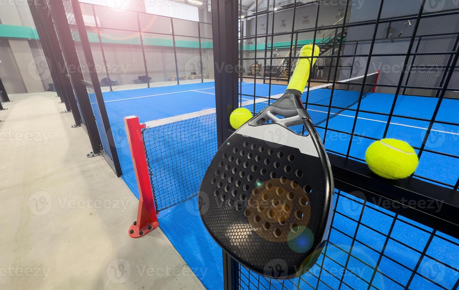padel racket on a padel court with a ball photo