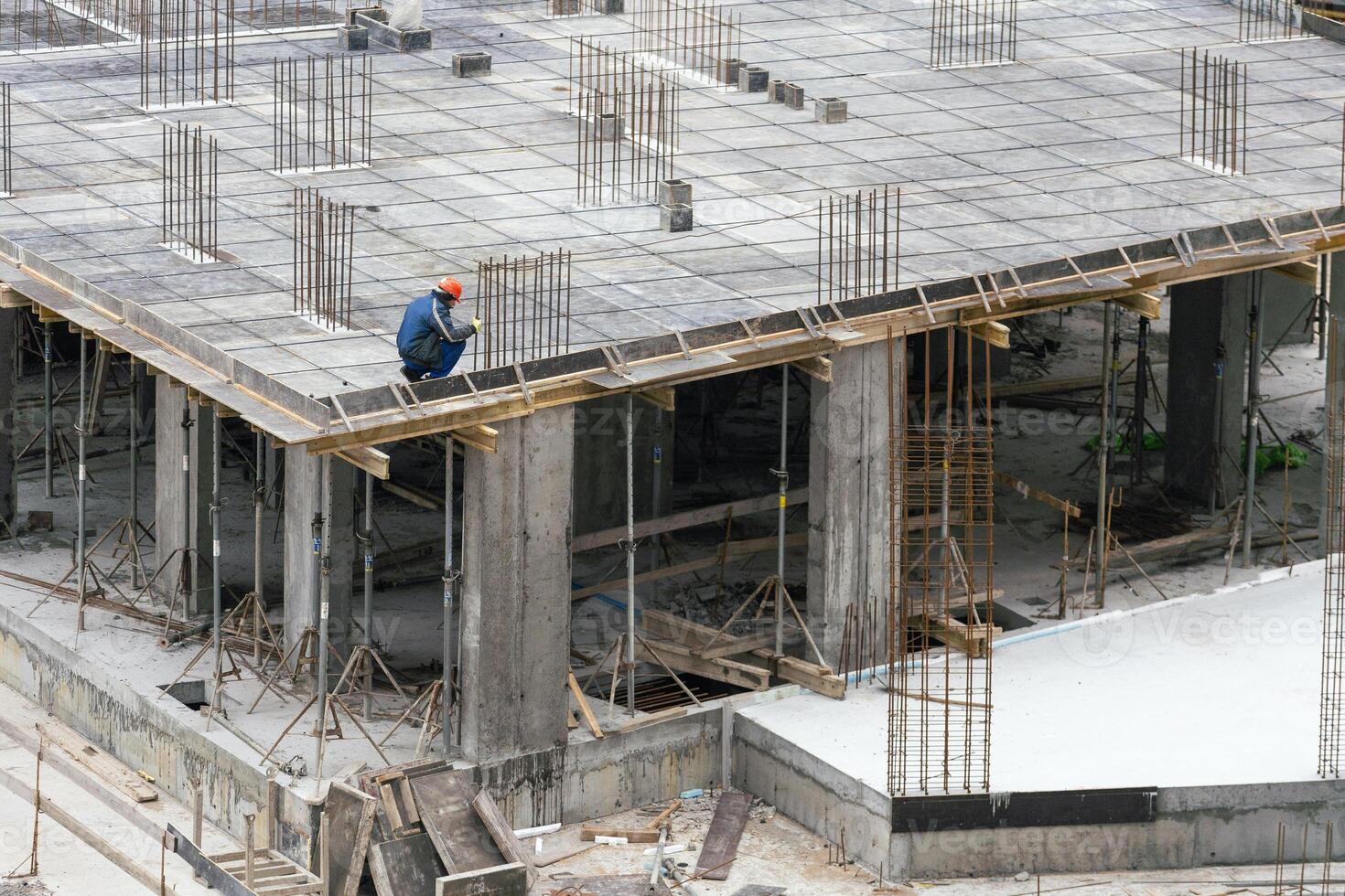 Construction workers working on Construction machine. Aerial platform for workers who work at height on buildings. photo