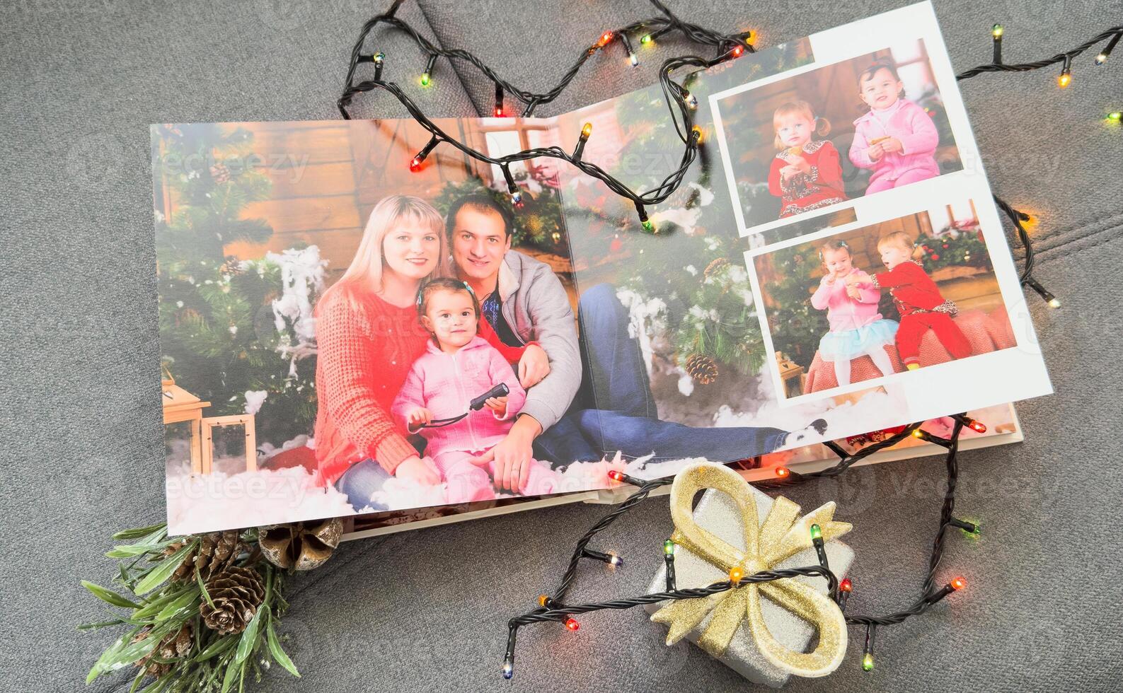 photobooks near the New Year tree, colored as a gift for the holiday. photo
