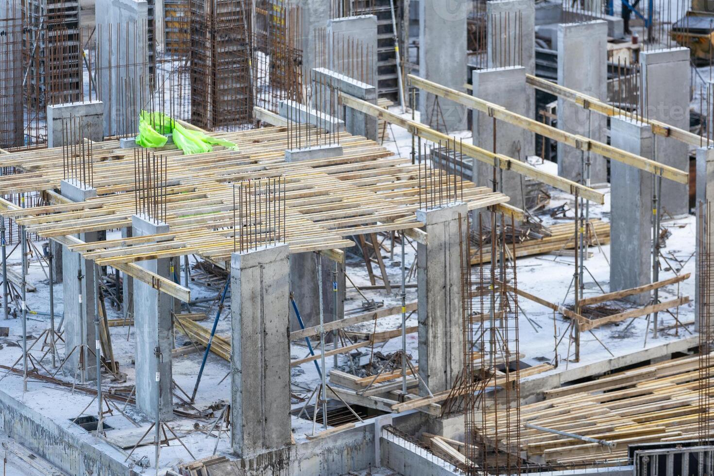 Construction workers fabricating steel reinforcement bar at the construction site photo
