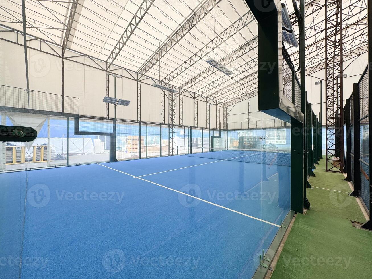 Padel court with lines and net indoor photo