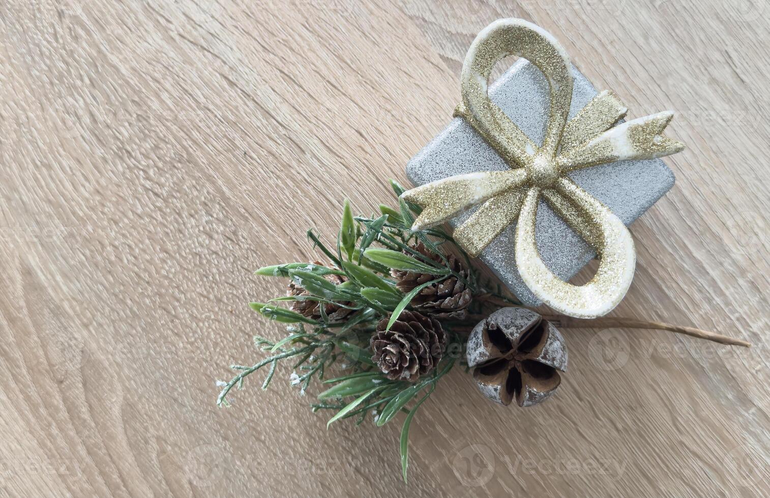 Festive top view Christmas scene with wrapped gifts, ornaments, and greenery arranged on a backdrop. Perfect for holiday themes and celebrations photo