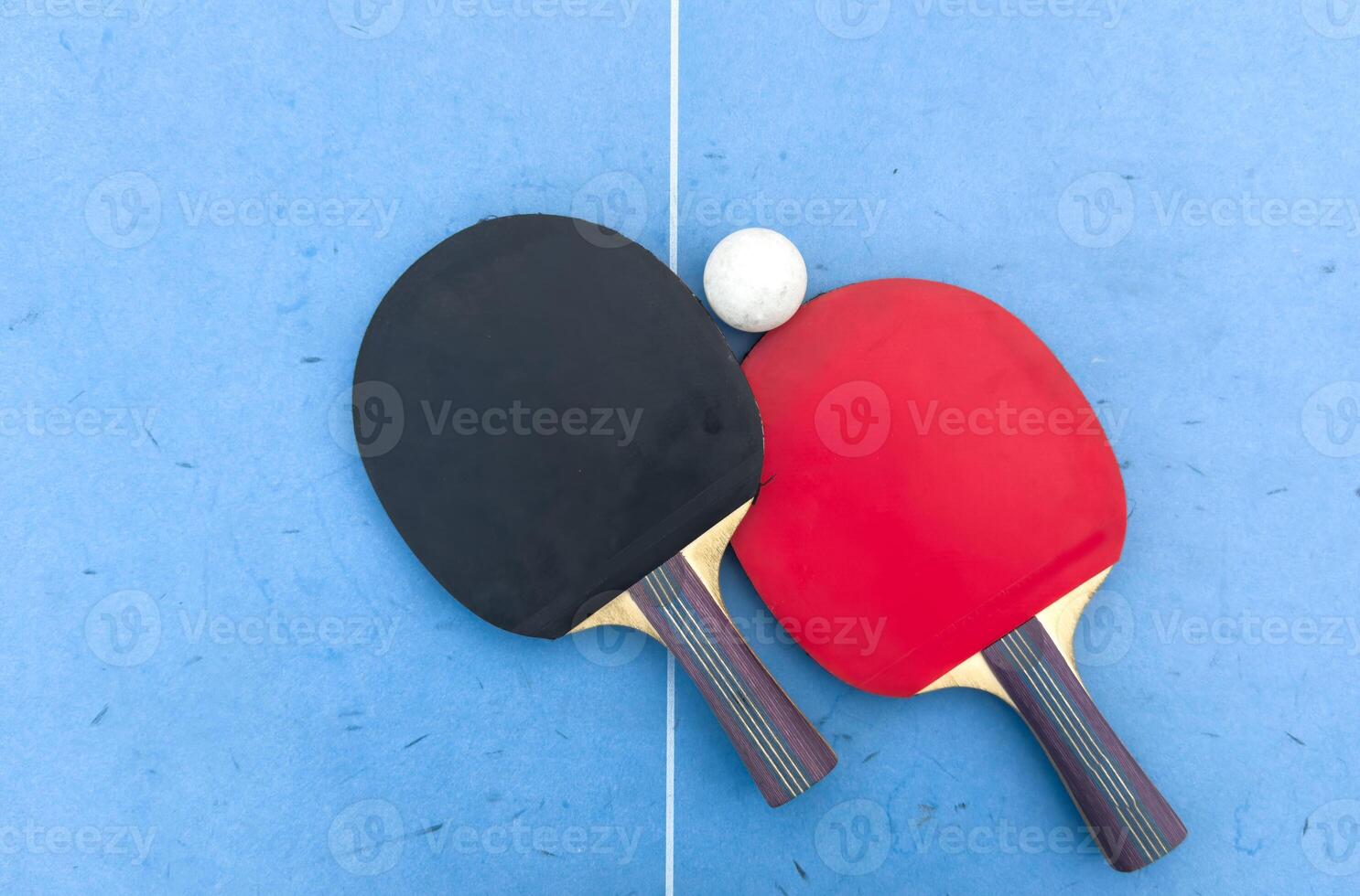 tennis rackets for playing ping pong on blue table, ping pong concept, active sports photo