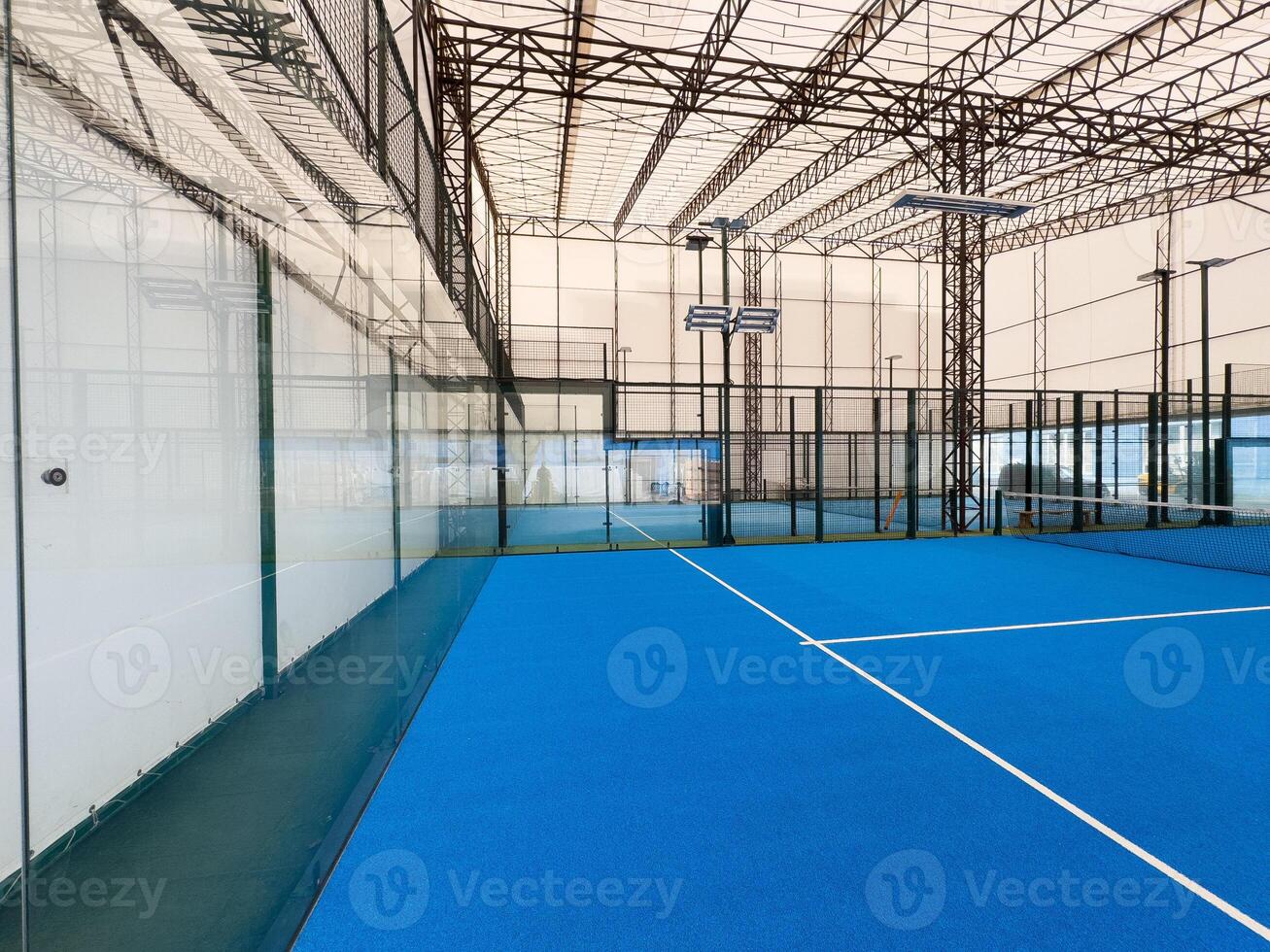Padel court with lines and net indoor photo