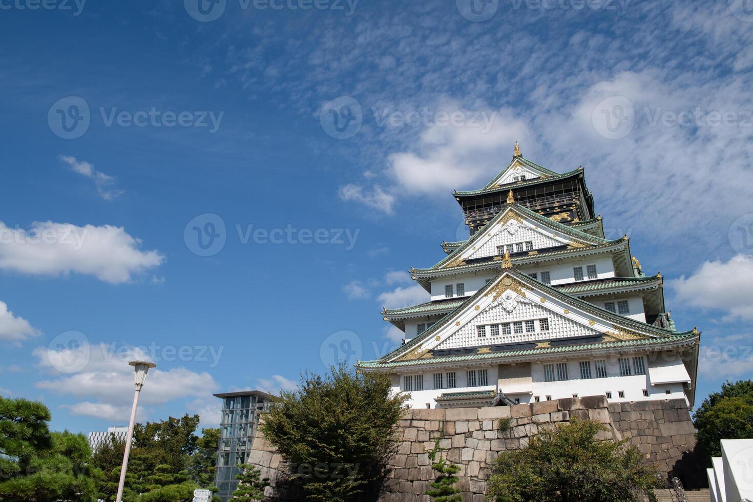 Osaka castle with blue sky background at Osaka city, Japan photo