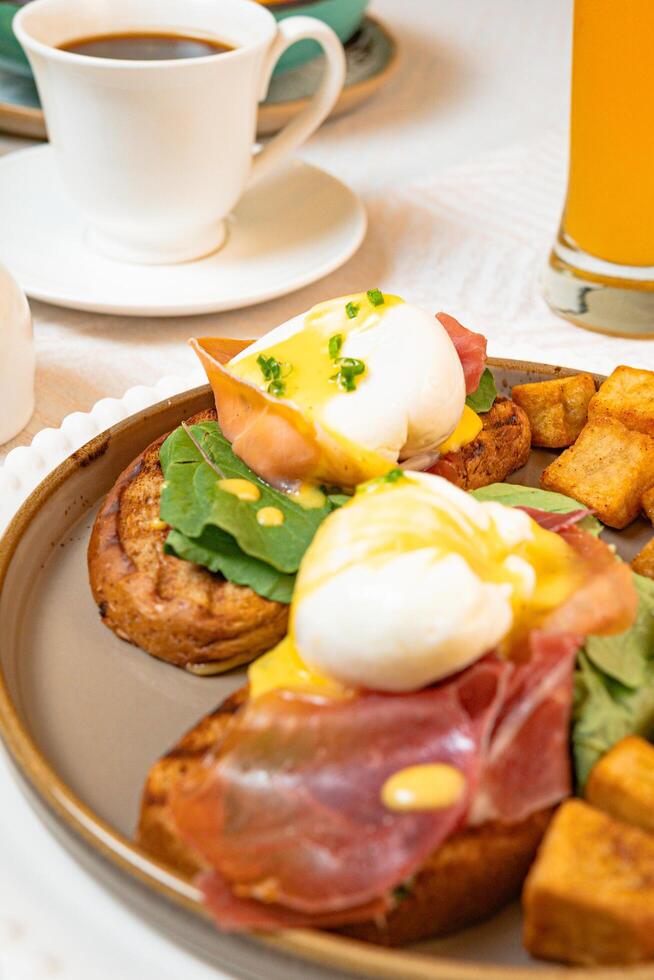 Gourmet breakfast with pieces of pork cracklings, toast, burrata, and serrano ham photo
