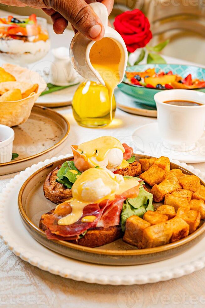 Gourmet breakfast with pieces of pork cracklings, toast, burrata, and serrano ham photo