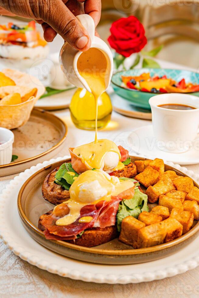 Gourmet breakfast with pieces of pork cracklings, toast, burrata, and serrano ham photo