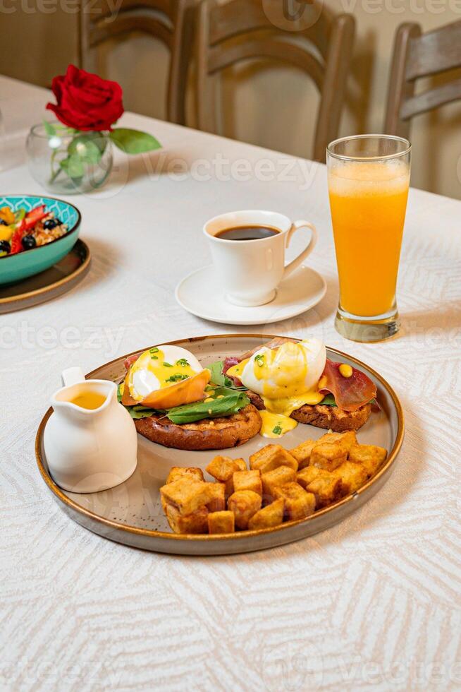 Gourmet breakfast with pieces of pork cracklings, toast, burrata, and serrano ham photo