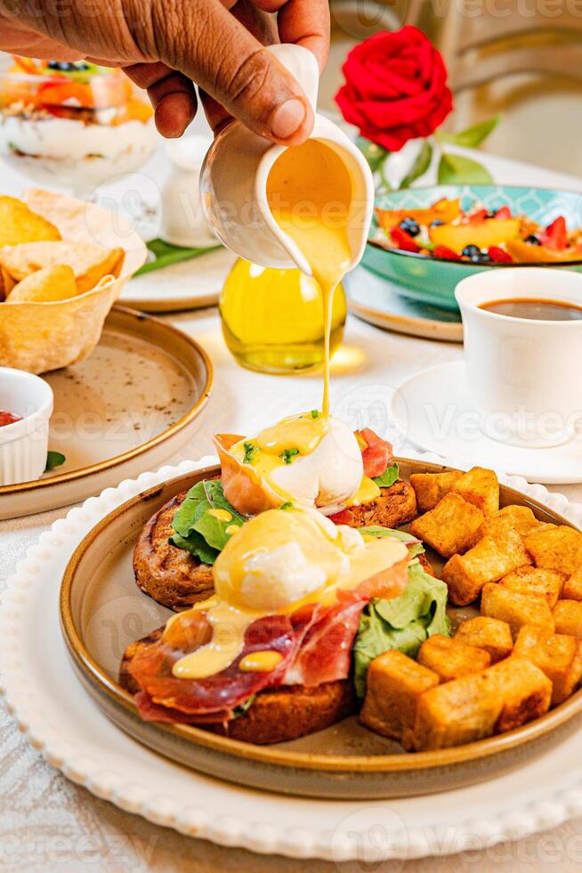 Gourmet breakfast with pieces of pork cracklings, toast, burrata, and serrano ham photo