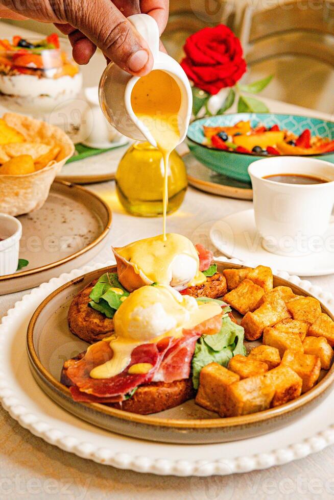 Gourmet breakfast with pieces of pork cracklings, toast, burrata, and serrano ham photo