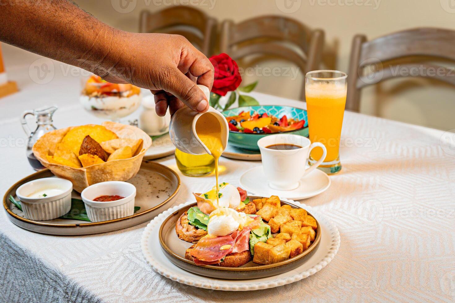 Gourmet breakfast with pieces of pork cracklings, toast, burrata, and serrano ham photo