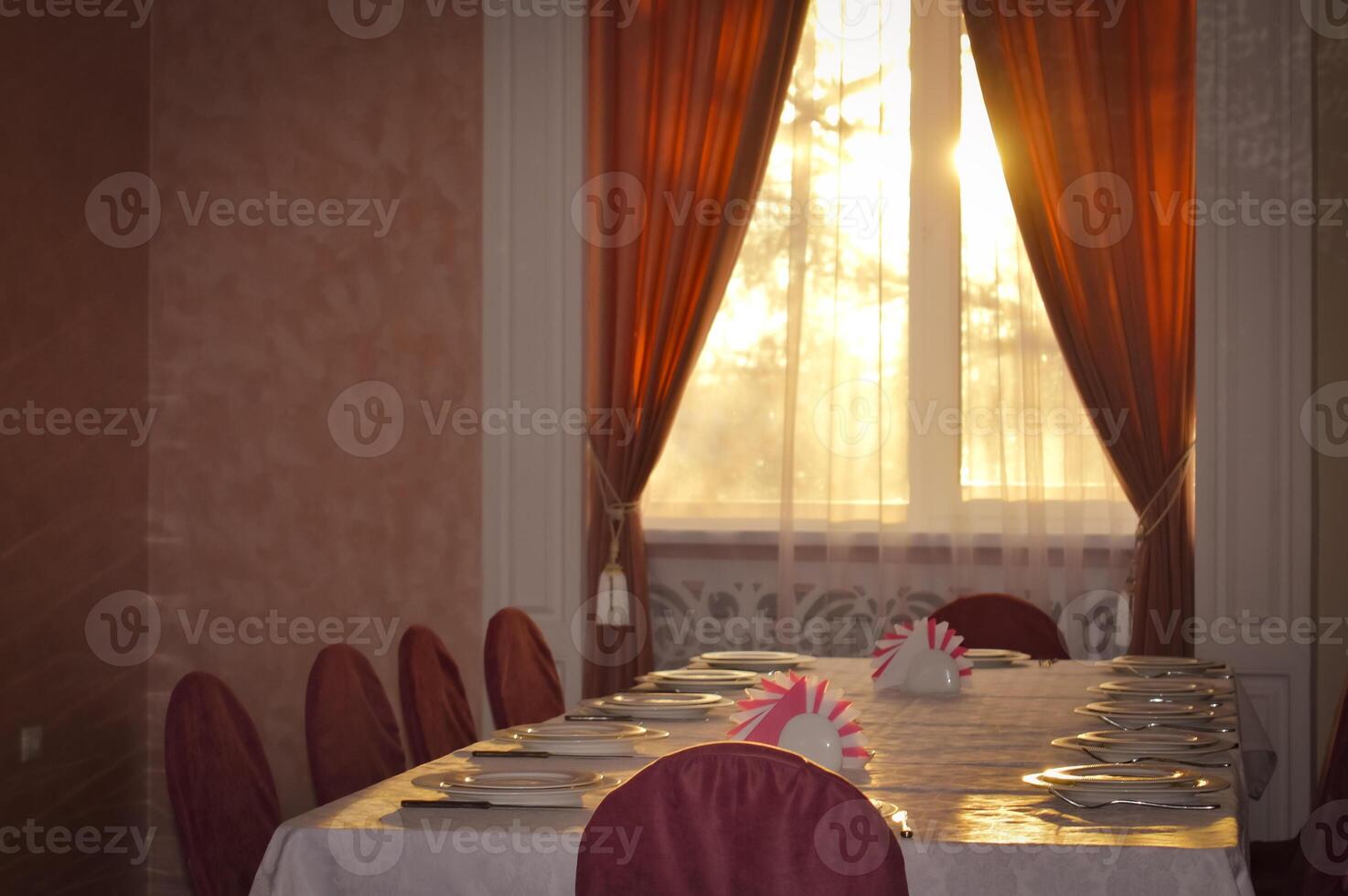 an empty hall is a classic restaurant with curtains white tablecloths and Romanesque decor. High quality photo